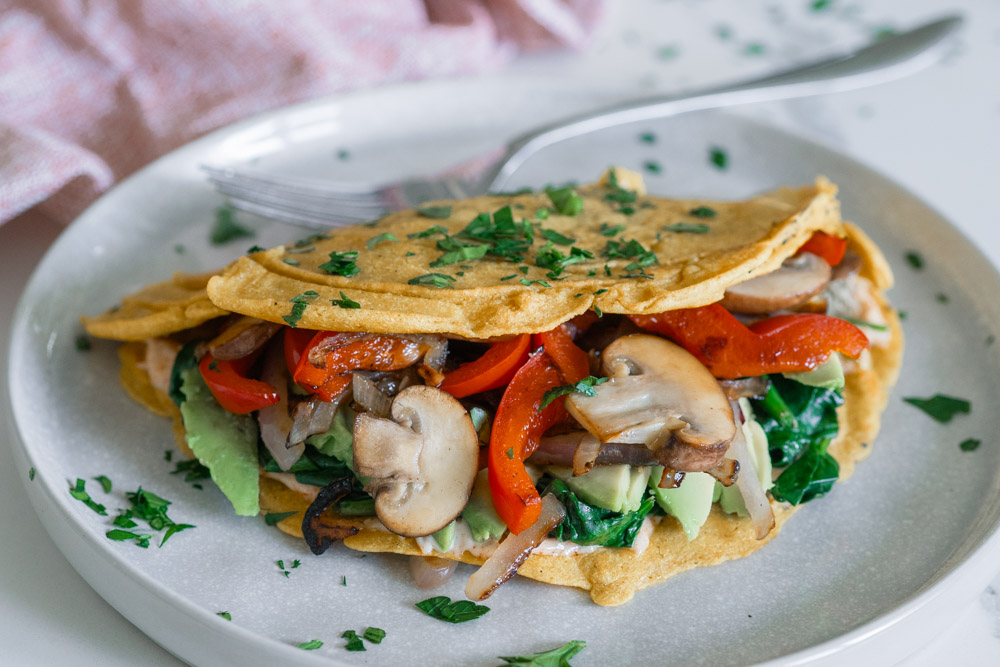 Vegan chickpea omelette with sauteed veggies and smoked paprika aioli.