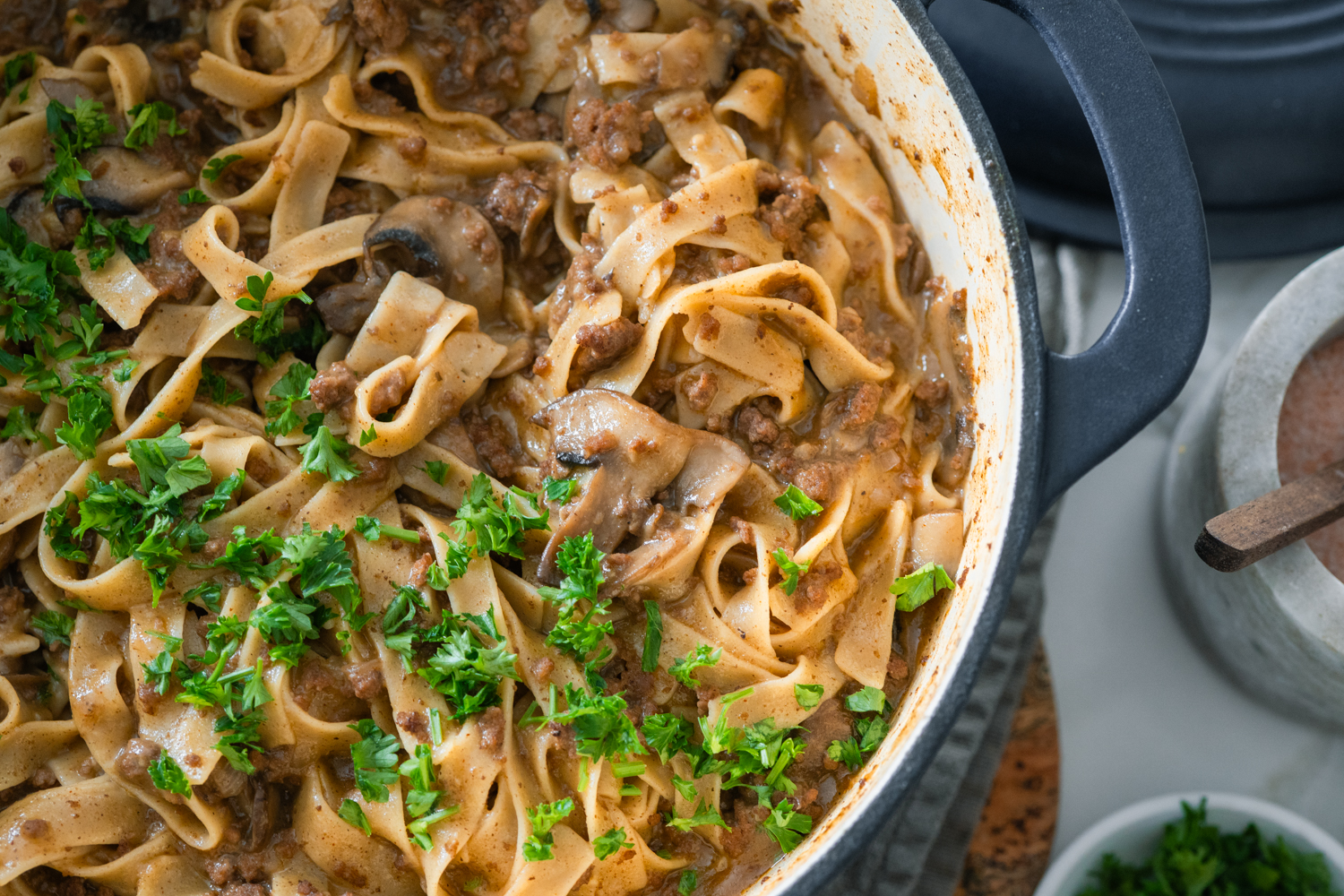 Hearty beef stroganoff in a pot on the table.
