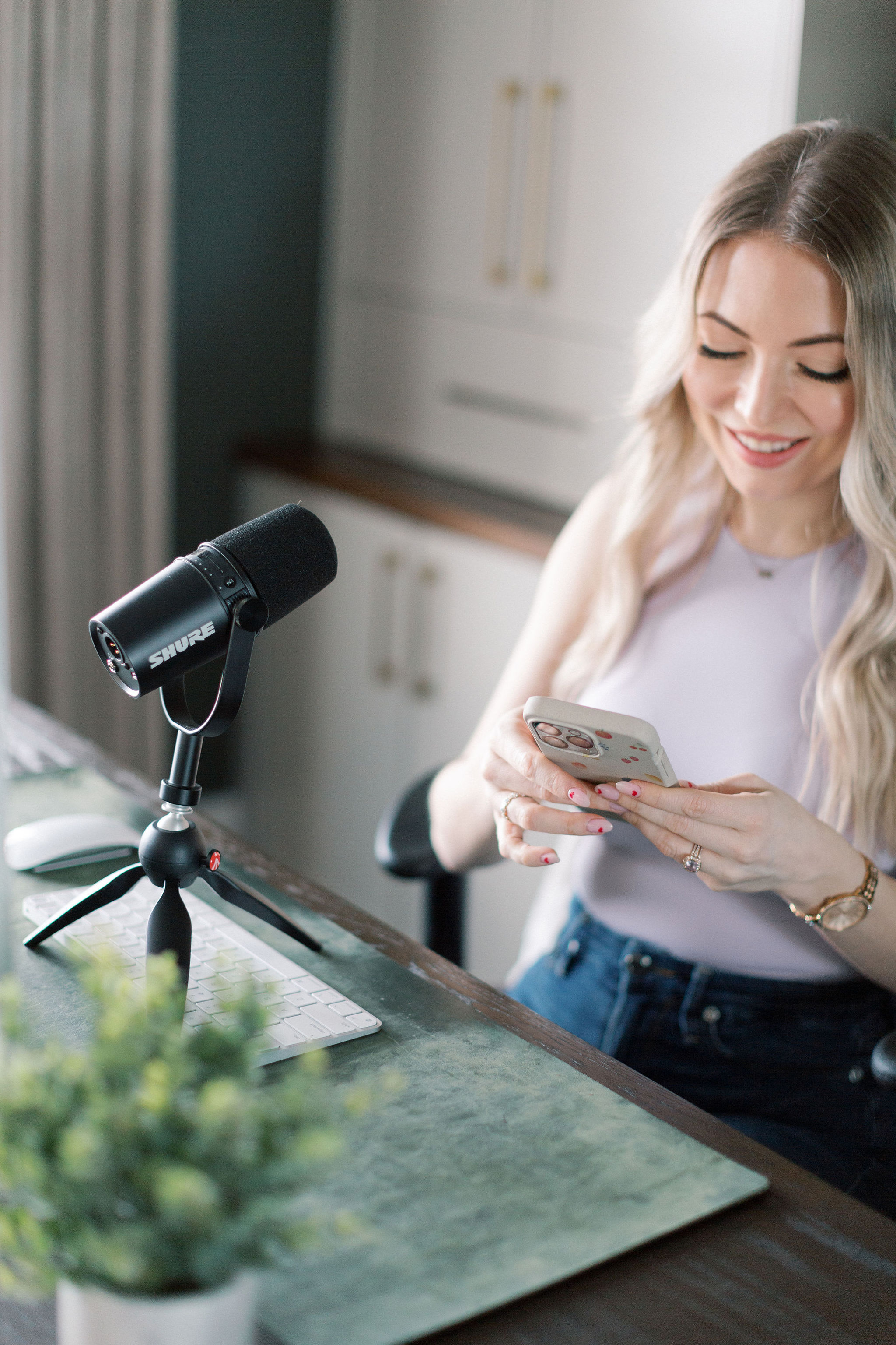 Katie Stewart, Acne Nutritionist, recording at the mic