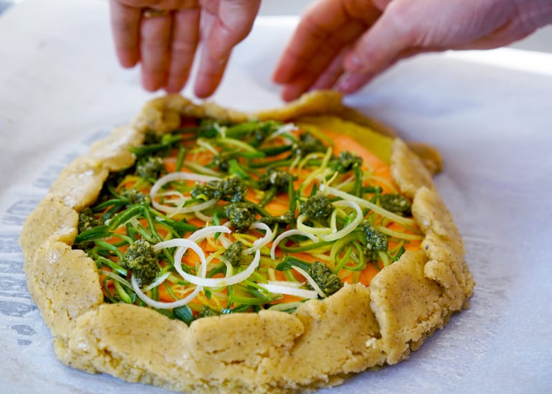 Sweet potato, leek, and pesto in a paleo galette made with almond flour and arrowroot starch.