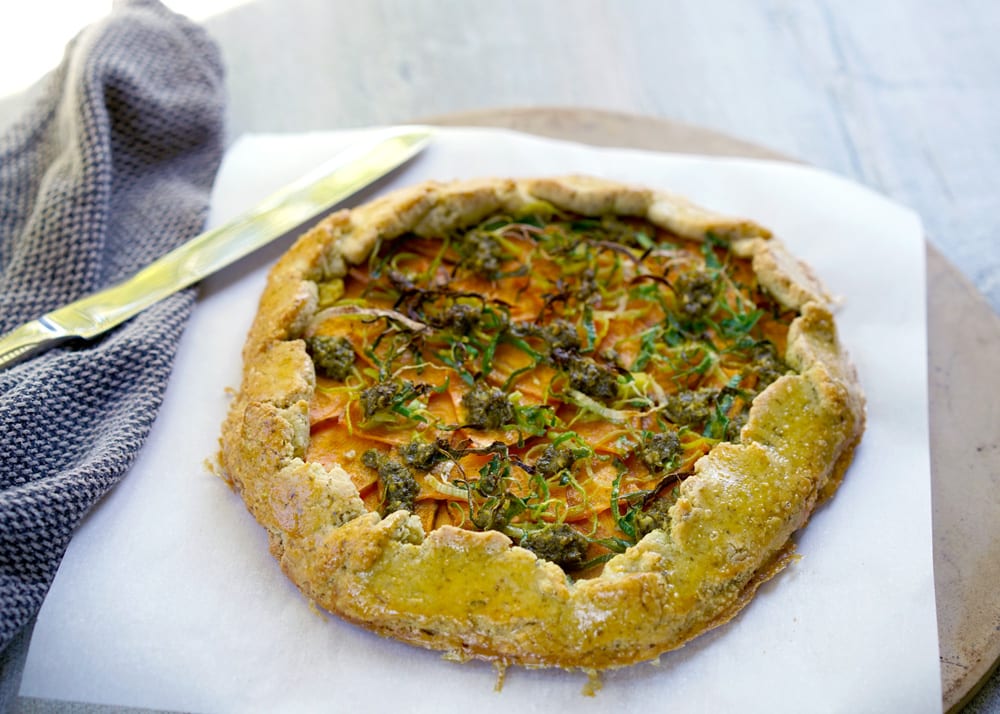 Sweet potato, leek, and pesto in a paleo galette made with almond flour and arrowroot starch.