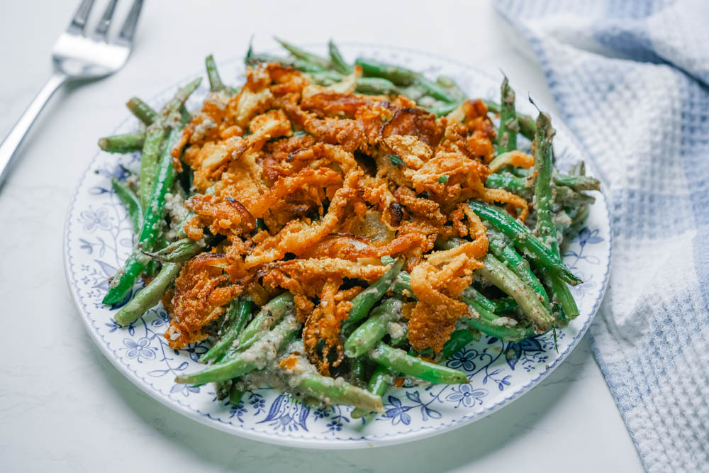 Paleo green beans with fried onions on a plate.
