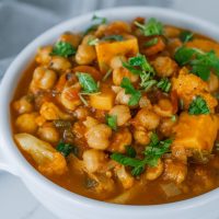 one pot chickpea stew in a white bowl.