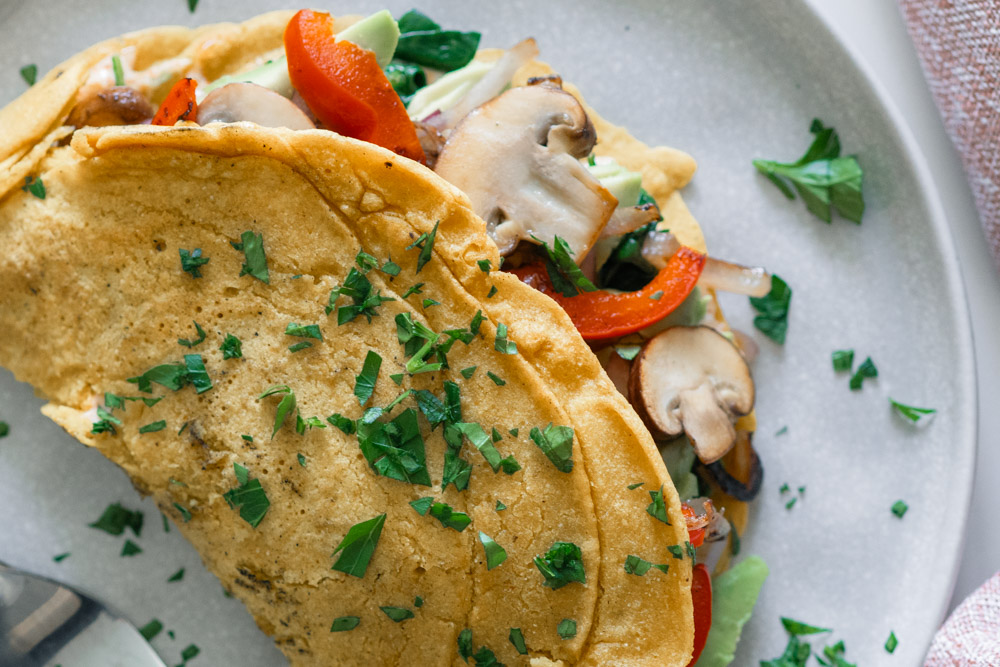 Vegan chickpea omelette with sauteed veggies and smoked paprika aioli.