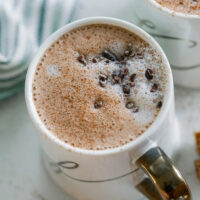 Acne Friendly Latte in a white and gold cup.